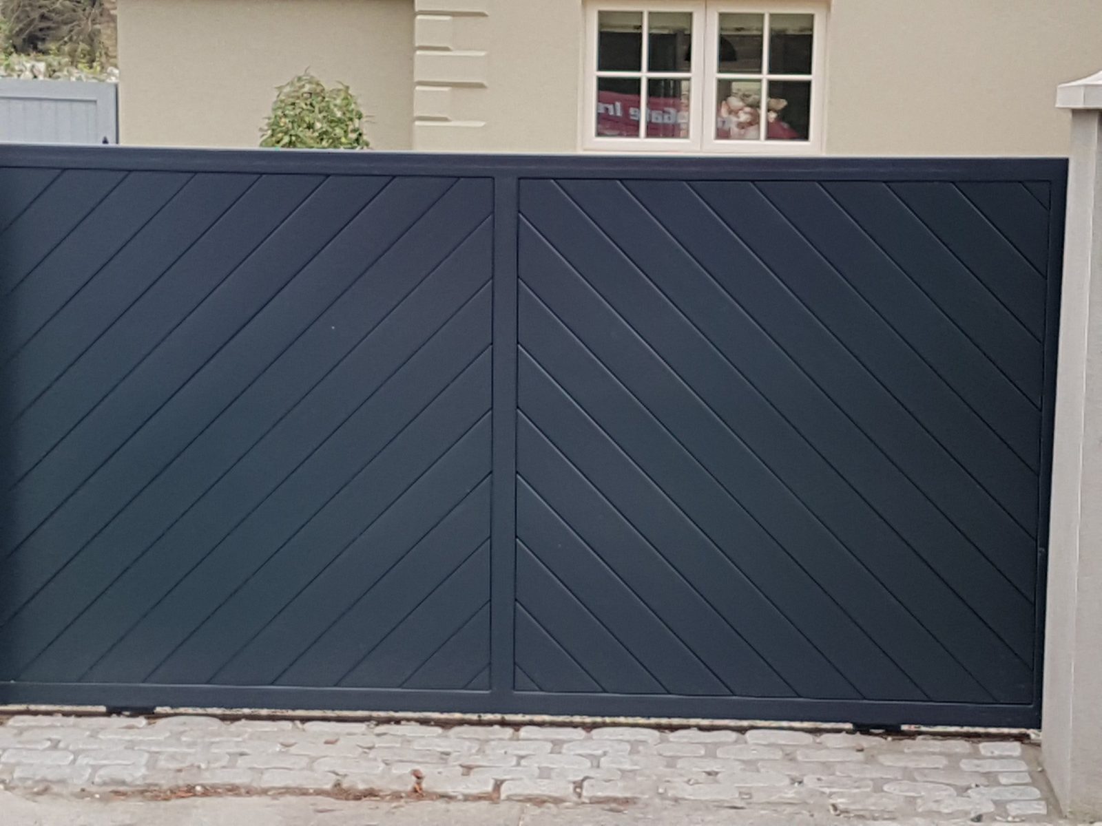 Herringbone-panel gates like these for homes in Downpatrick